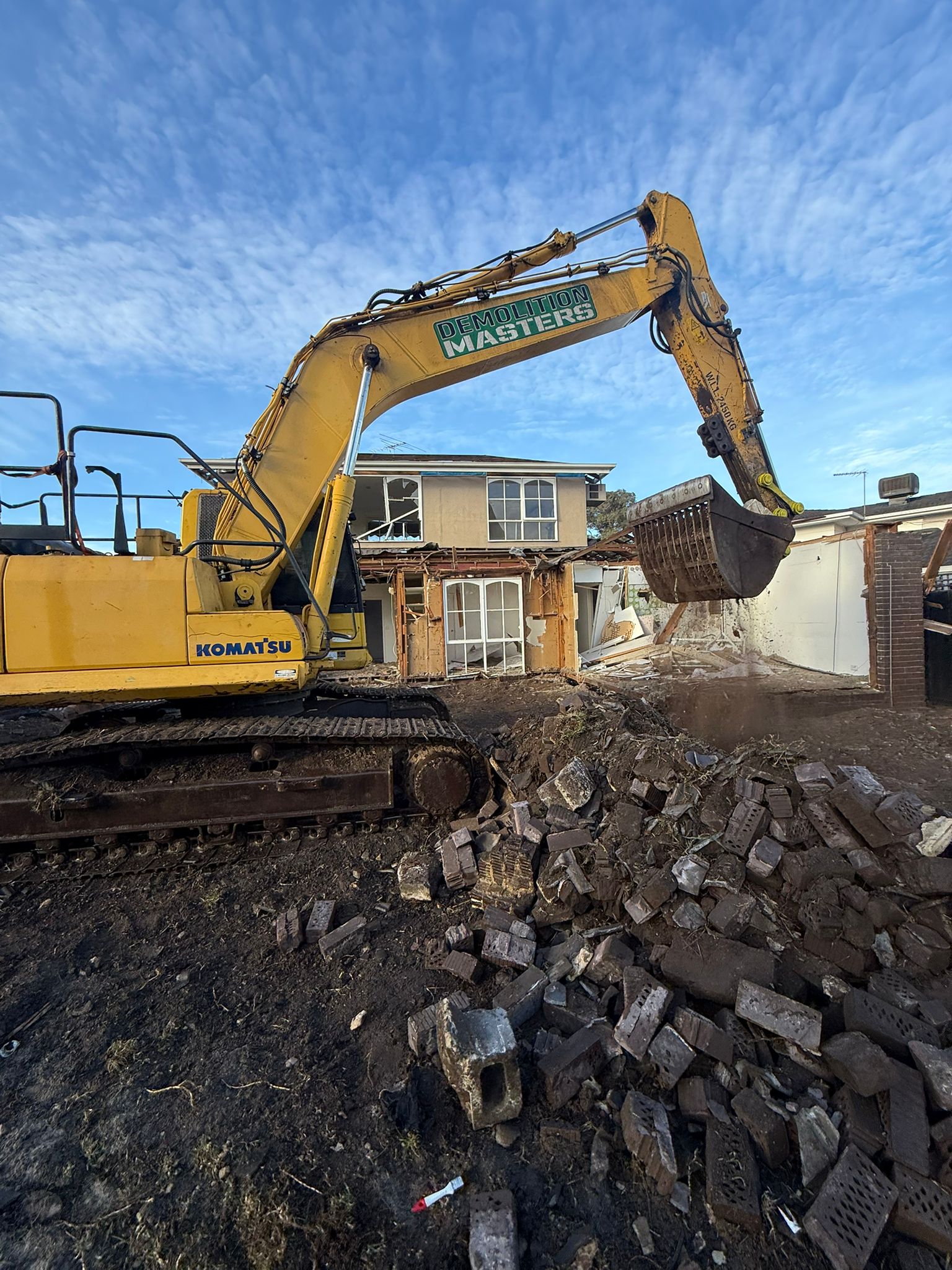 Demolition Masters Komatsu excavator working on a Melbourne demolition site